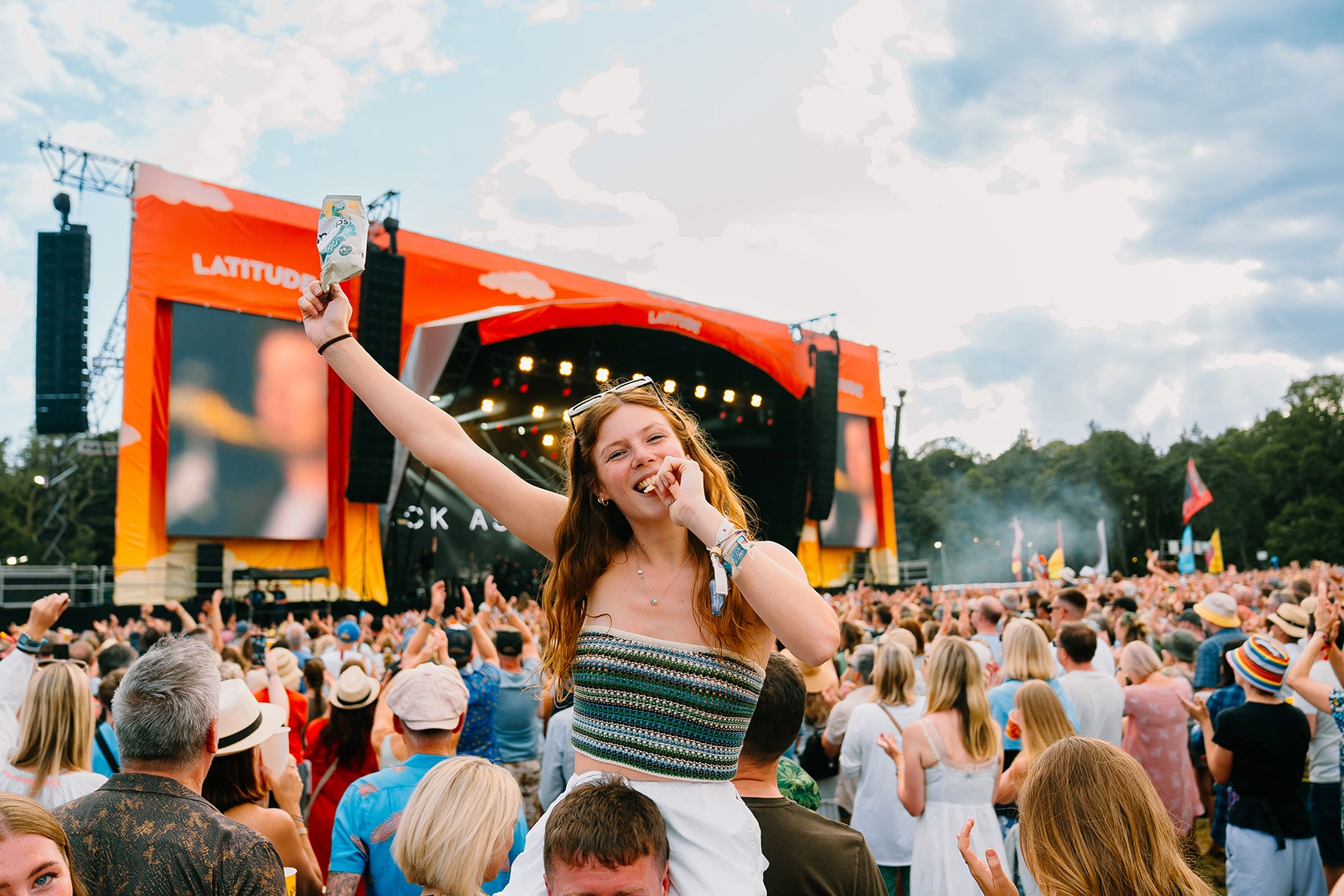 Women at latitude holding a popchips bag