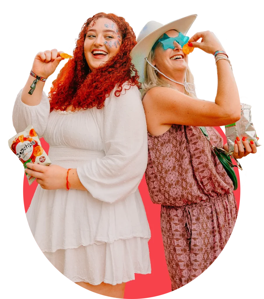Two women within a circle holding popchips packets